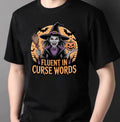 Fluent in Curse Words Halloween T-Shirt in black with cackling witch and pumpkin graphic