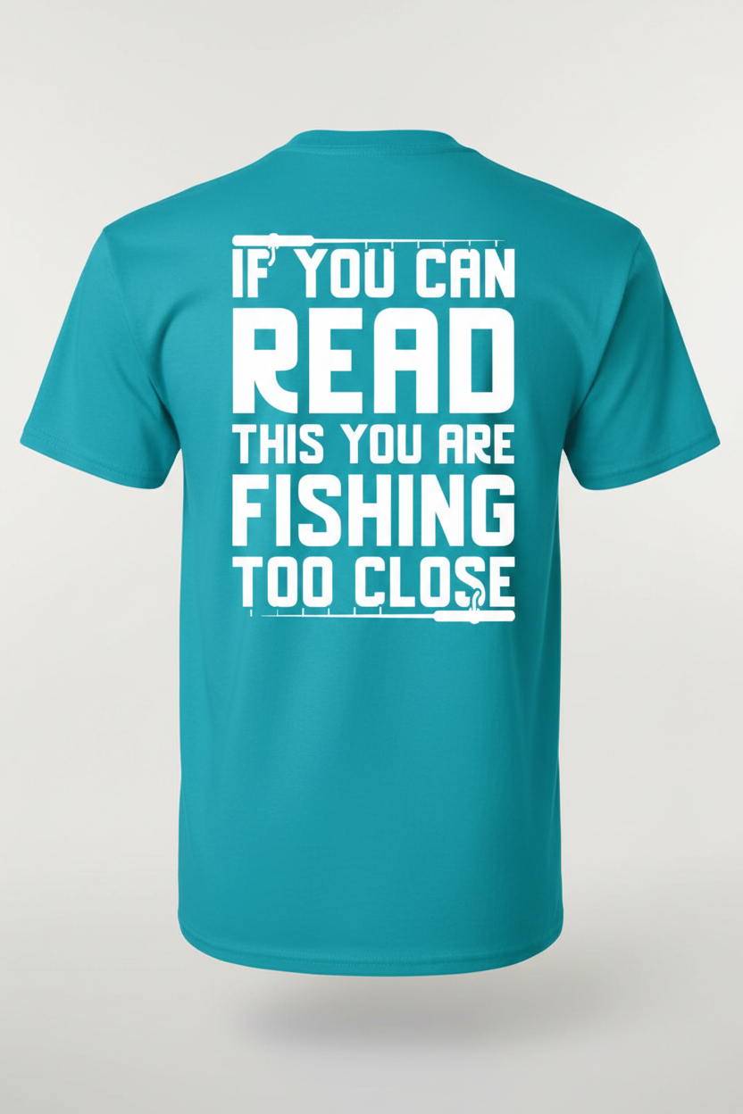 If You Can Read This You Are Fishing Too Close on teal t-shirt back white lettering